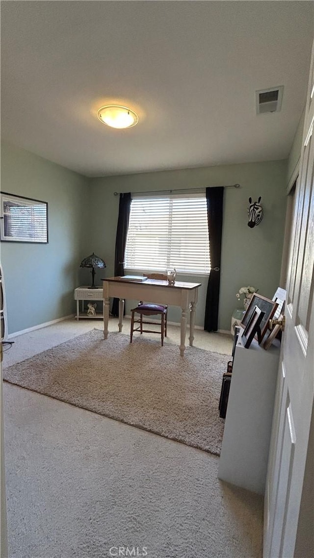 home office featuring carpet, visible vents, and baseboards