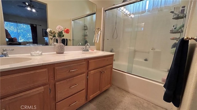 full bath featuring enclosed tub / shower combo, a sink, and double vanity