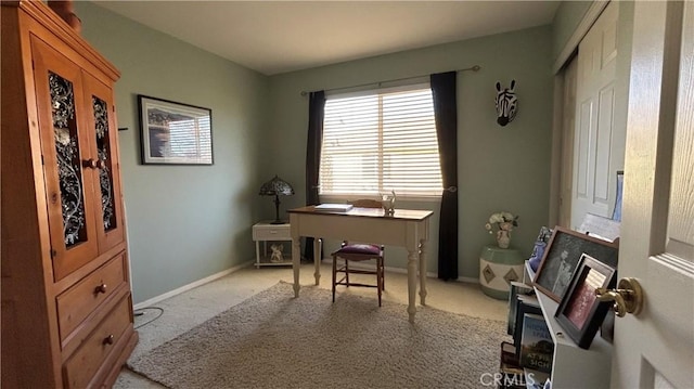 office with light colored carpet and baseboards