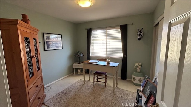 office space with light colored carpet and baseboards