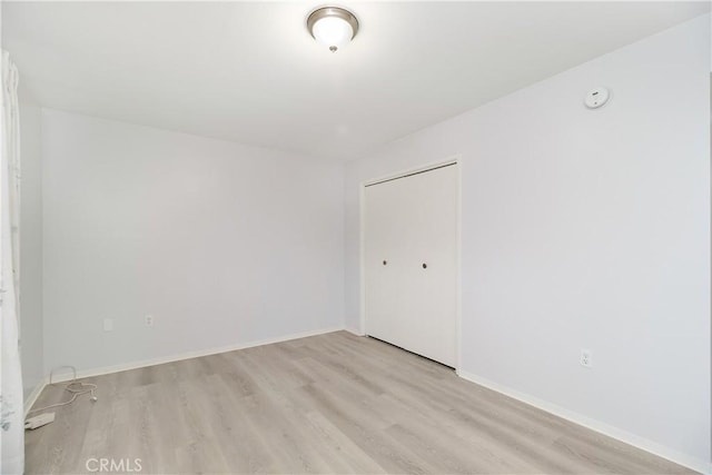 spare room featuring light hardwood / wood-style flooring