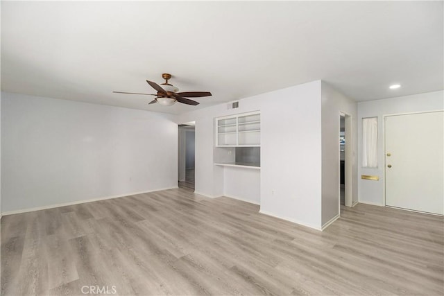 unfurnished living room featuring light hardwood / wood-style floors and ceiling fan