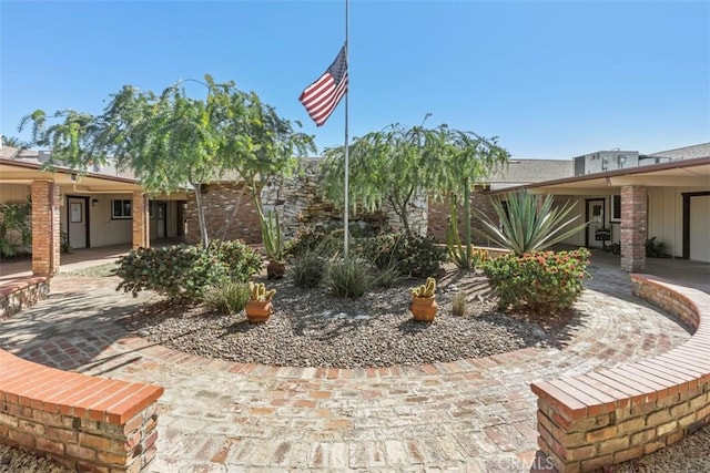 view of home's community featuring a patio area