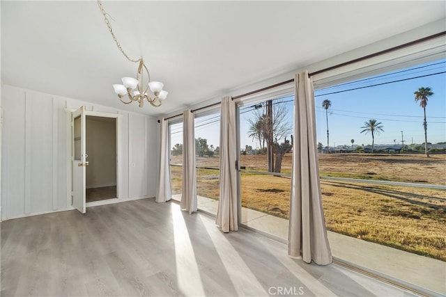 entryway featuring a notable chandelier and light hardwood / wood-style floors