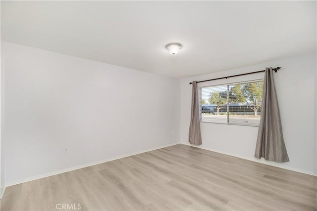 empty room with light wood-type flooring