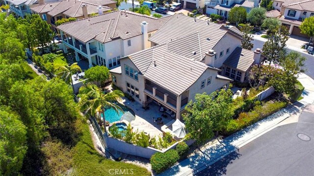 birds eye view of property with a residential view