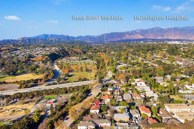 birds eye view of property featuring a mountain view