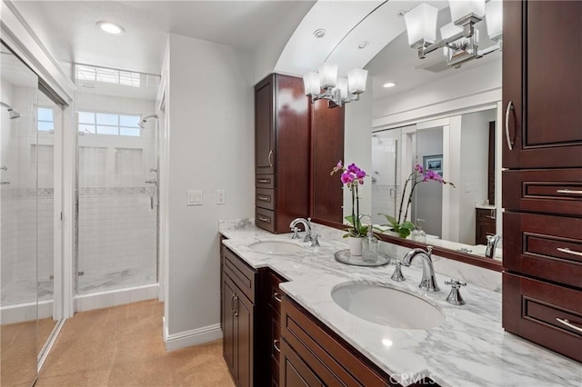 bathroom featuring an enclosed shower and vanity