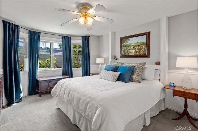 bedroom with ceiling fan and light colored carpet