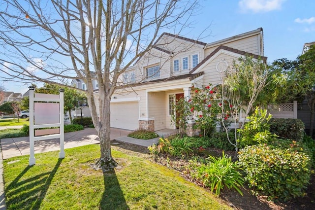 view of front of property with a front yard and a garage