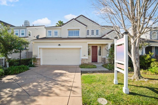 view of front facade featuring a front yard and a garage