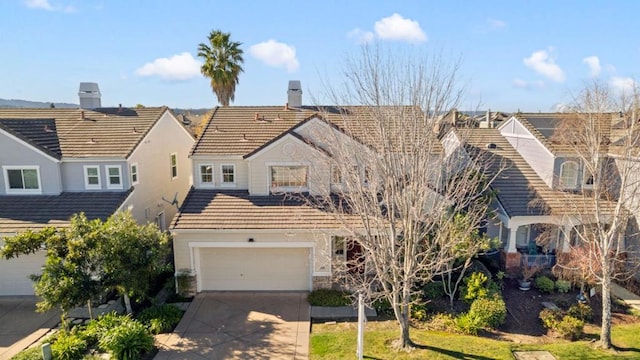 view of front of property featuring a garage and a front lawn