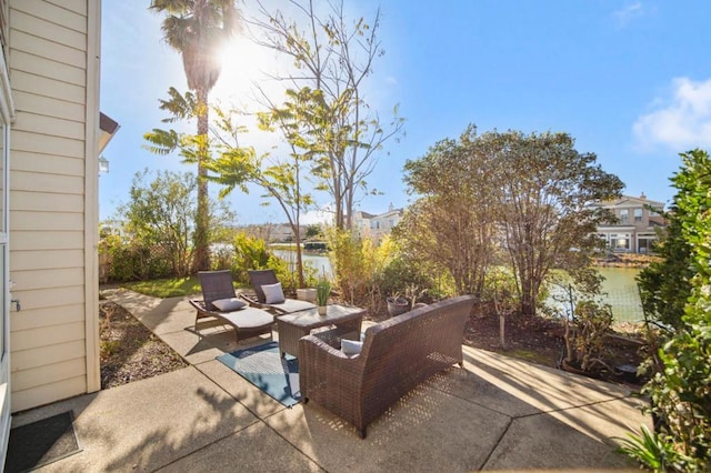 view of patio featuring an outdoor hangout area and a water view