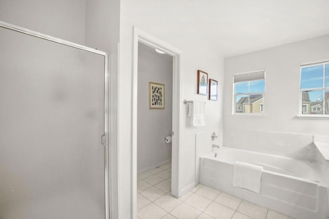 bathroom featuring tile patterned flooring and independent shower and bath