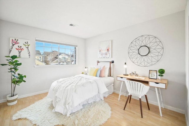 bedroom featuring hardwood / wood-style floors