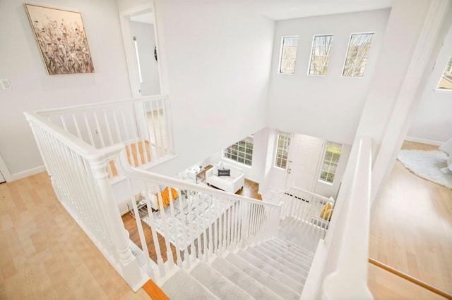 stairs featuring hardwood / wood-style flooring