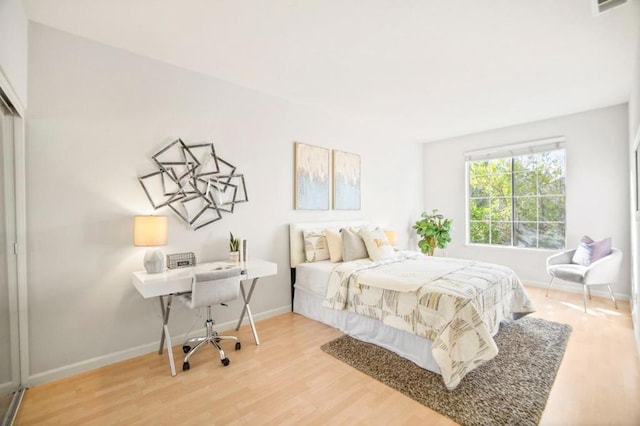 bedroom featuring hardwood / wood-style floors