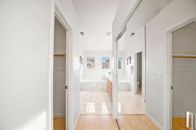 hall featuring light hardwood / wood-style flooring