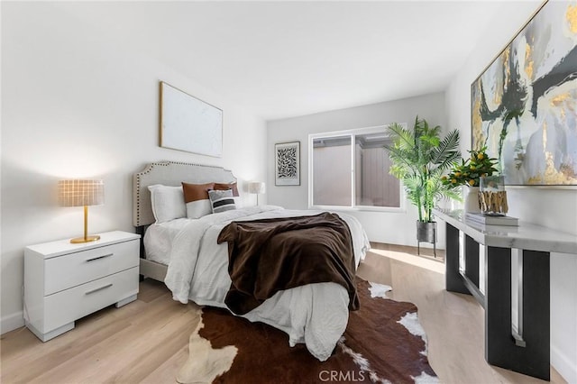 bedroom featuring light wood-type flooring