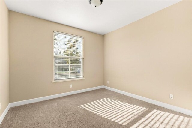 empty room featuring light carpet