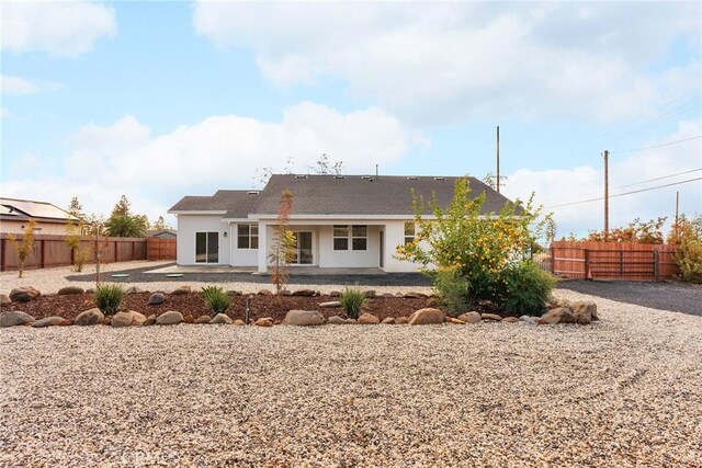 rear view of property featuring a patio