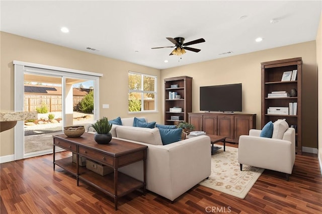 living area featuring ceiling fan, dark wood finished floors, visible vents, and recessed lighting