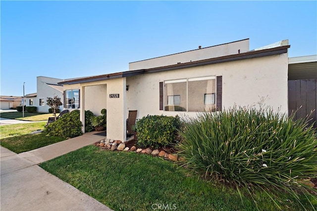 view of front of property with a front lawn