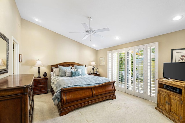 bedroom with ceiling fan, access to outside, vaulted ceiling, and light carpet