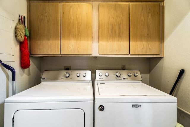 laundry area featuring cabinets and independent washer and dryer