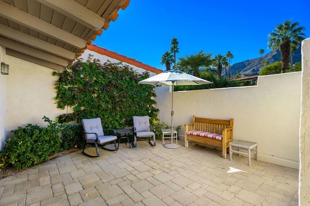 view of patio with a mountain view