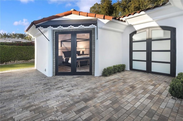 doorway to property with a patio and french doors