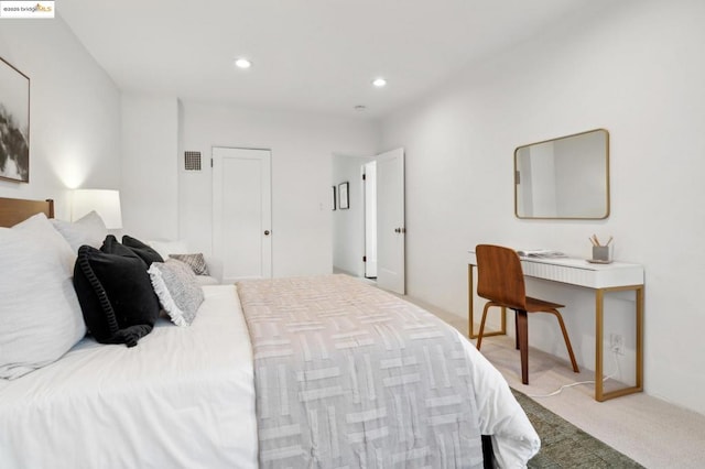 bedroom featuring light colored carpet