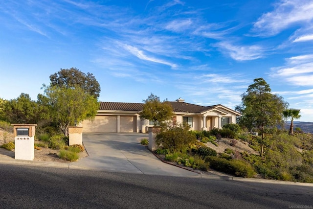 single story home with a garage