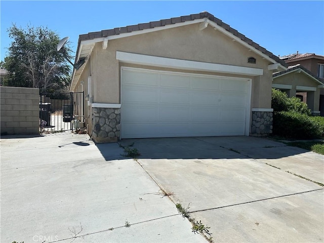 view of side of home with a garage