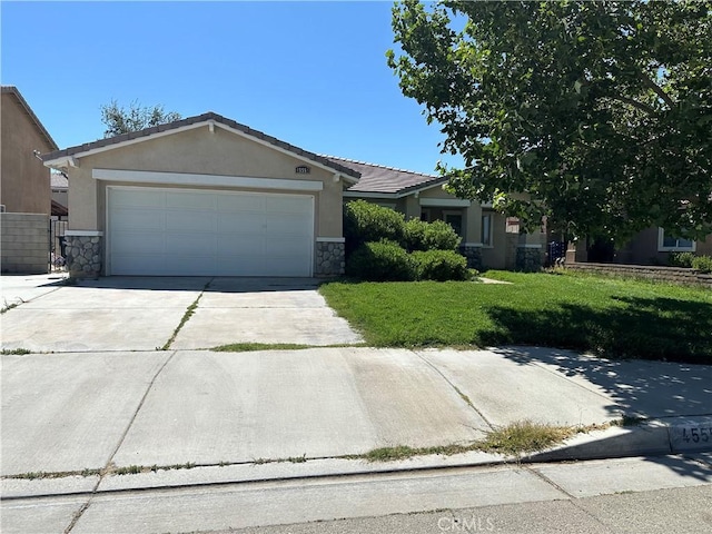 ranch-style house featuring a garage and a front yard