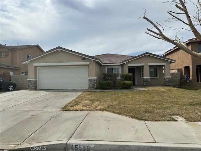 view of front of house with a garage and a front yard