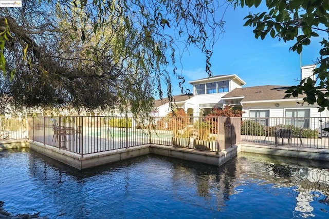 dock area featuring a fenced in pool