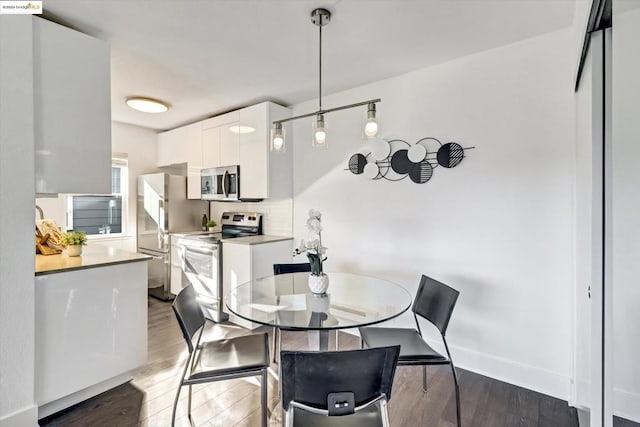 dining room featuring hardwood / wood-style flooring