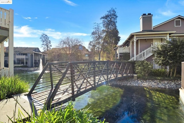 view of home's community featuring a water view