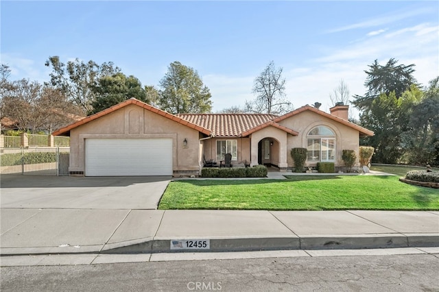 view of front of house with a front yard and a garage