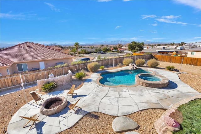 view of pool featuring a fire pit, an in ground hot tub, and a patio