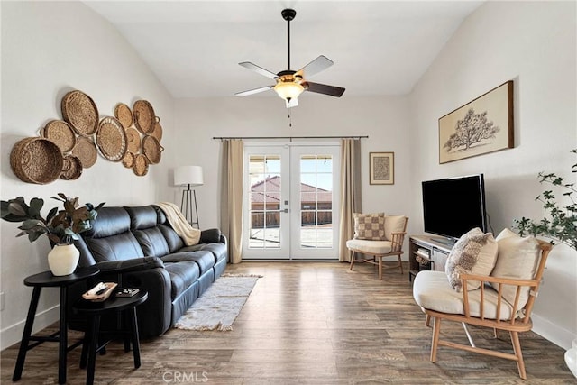 living room featuring vaulted ceiling, ceiling fan, french doors, and hardwood / wood-style floors