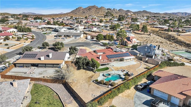 birds eye view of property featuring a mountain view