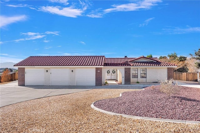 ranch-style home with a garage