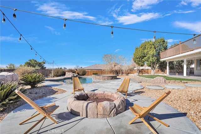 view of patio / terrace featuring a fire pit and a fenced in pool