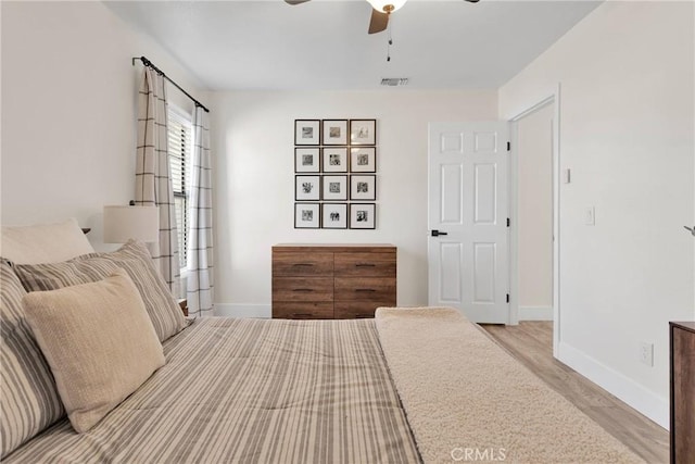 bedroom featuring ceiling fan and light hardwood / wood-style flooring