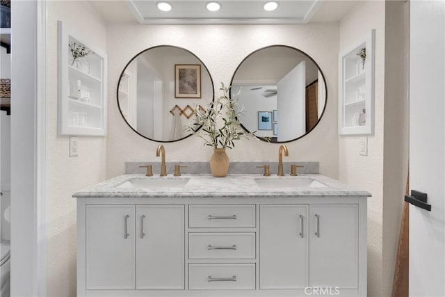 bathroom featuring toilet and vanity