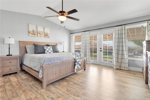 bedroom featuring lofted ceiling, french doors, access to exterior, ceiling fan, and light hardwood / wood-style floors