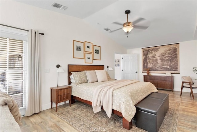 bedroom featuring ceiling fan, radiator, and light hardwood / wood-style floors