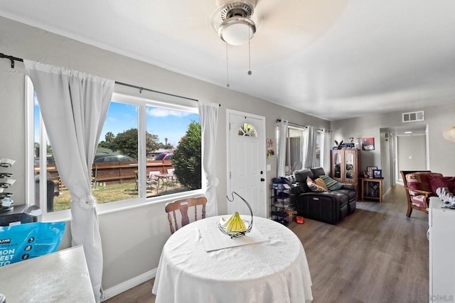 dining area with ceiling fan and hardwood / wood-style floors